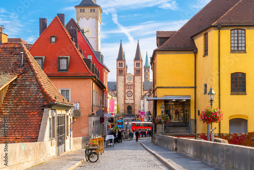 The Old Main bridge or Mainbrücke, at the entrance to the city with the Grafeneckart tower and Würzburger Dom cathedral rising above the townscape, in the Bavarian city of Würzburg, Germany.	