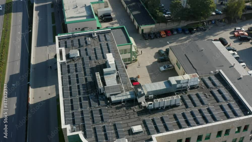 Roof with solar panels of an apartment building in the city of Gdansk, Poland Aerial view. Production of renewable energy concept. Roof with solar panels of an apartment building in the city of Gdansk, Poland Aerial view. Production of renewable energy concept.