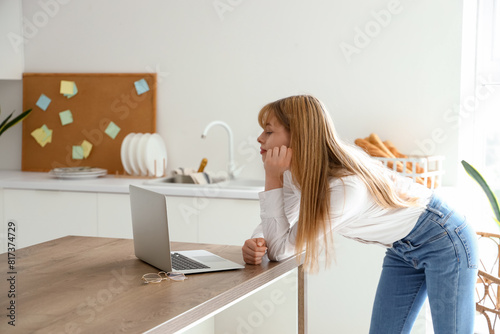 Teenage girl with laptop vi...