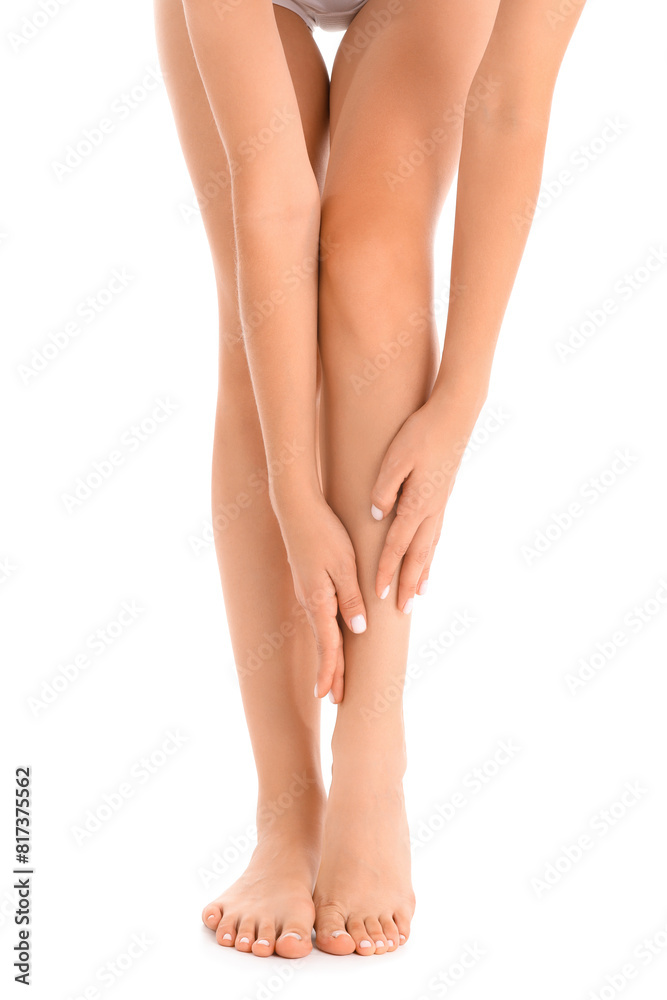 Beautiful young woman making foot massage on white background Beautiful young woman making foot massage on white background