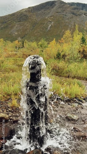 An underground geyser in Khibiny. Lake Maly Woodyavr. The purest water comes out of the ground. Valley of geysers. A thermal spring located in the middle of an endless valley, in a mountainous area.4К photo