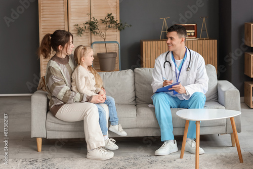Male pediatrician with clip...