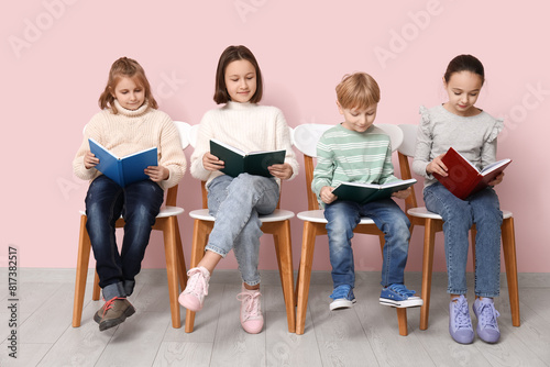Little children reading boo...
