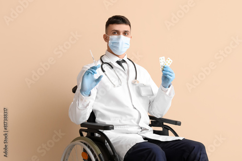 Young male doctor in wheelc...