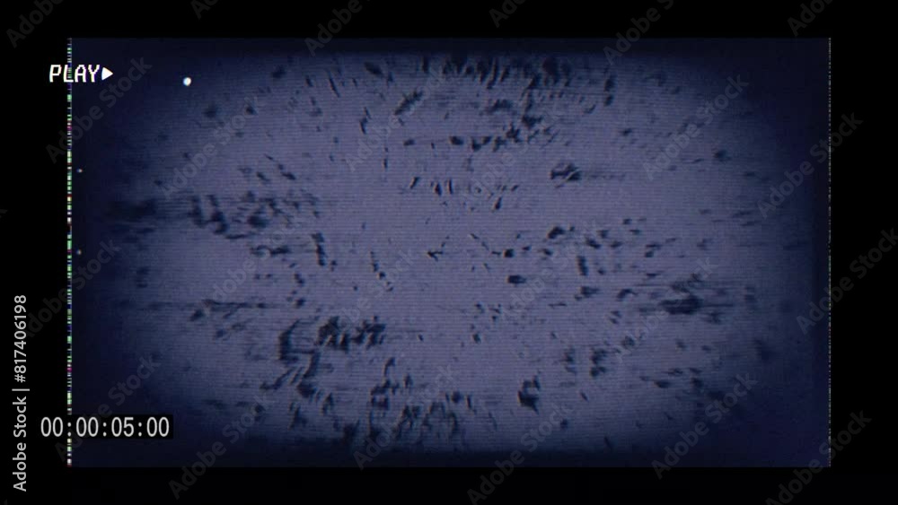 Old style video camera frame with fast moving images, glitches and static effects