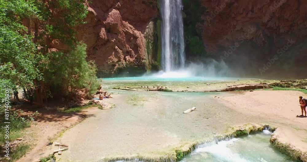 Havasupai reservation waterfall - wide drone shot moving backwards