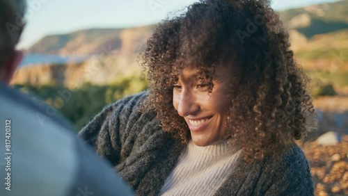 Relaxed brunette lying cliff nature smiling closeup. Happy curly woman flirting photo