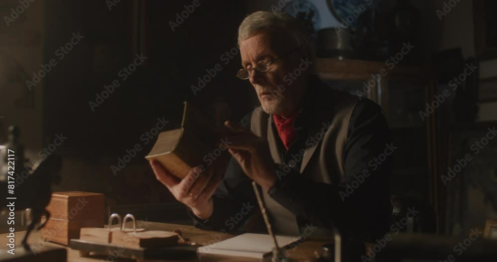 Old elegant man studying a book. Old elegant man studying a book.