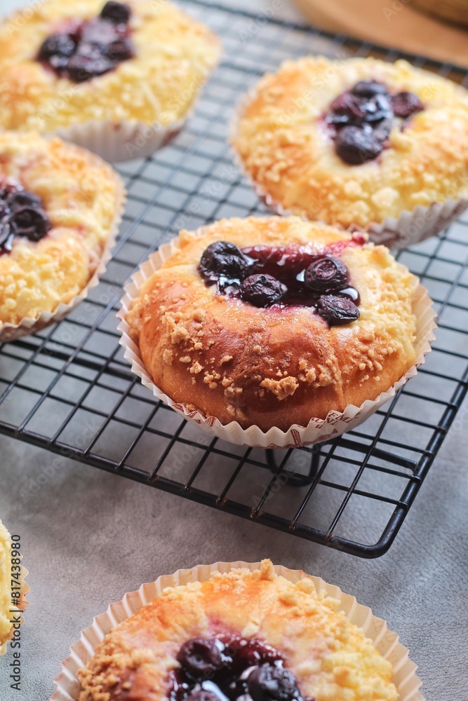 Blueberry streusel sweet bread with fresh berries and creamcheese on a wooden cutting board
Blueberry streusel sweet bread with fresh berries and creamcheese on a wooden cutting board