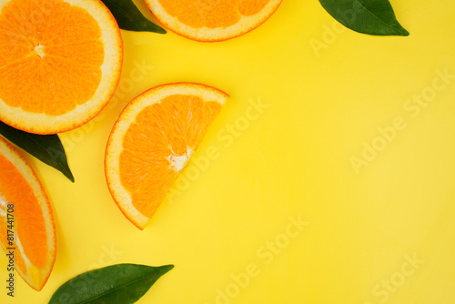 Summer fruit background concept  fresh orange slices and leaves with copy space
