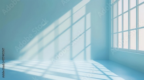 Empty light blue studio space with deep windows shadow. Sparse template and background