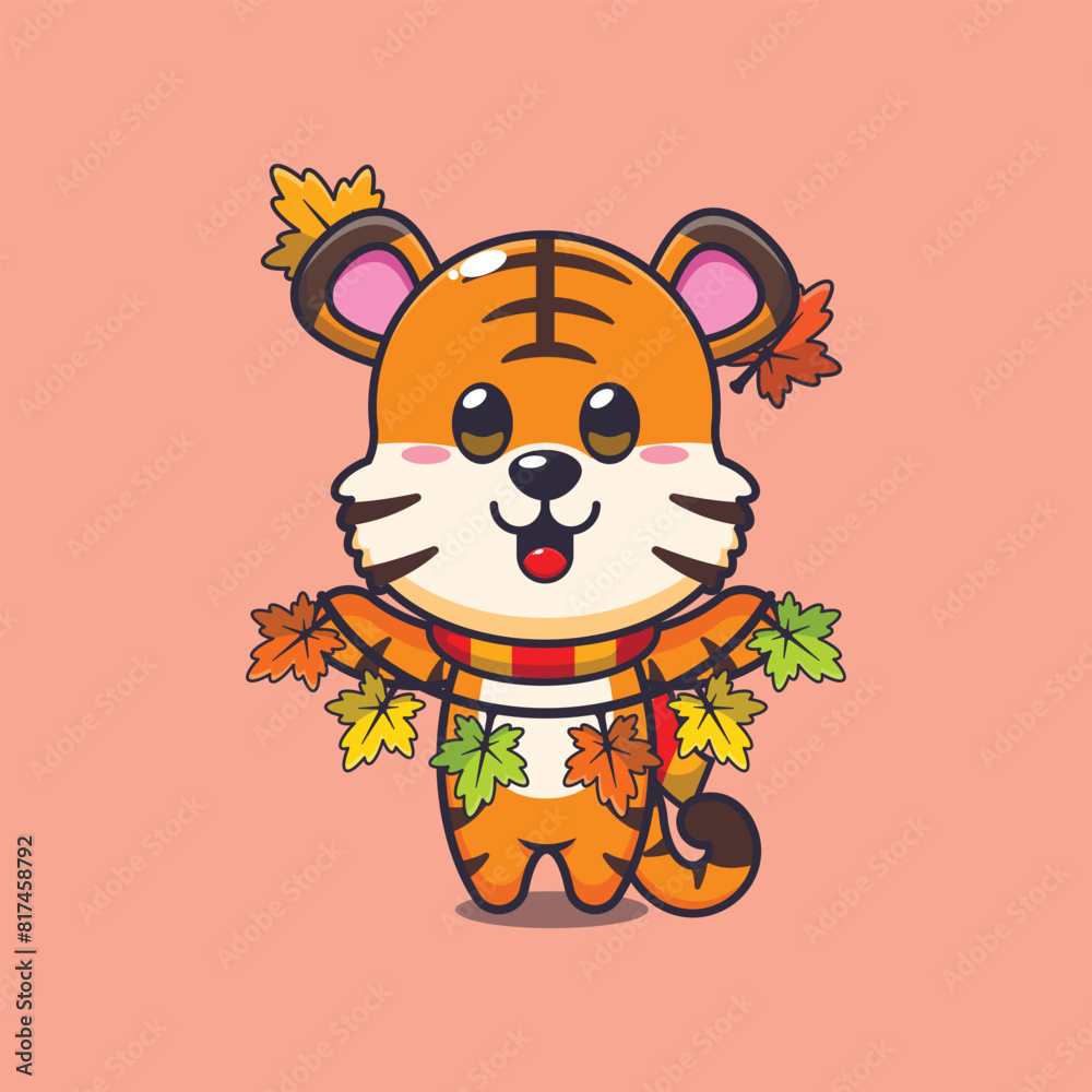 Obraz premium Cute tiger with autumn leaf decoration