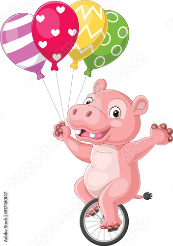 Cartoon hippo riding one wheel bike and holding colorful balloons © tigatelu