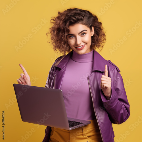 Photo portrait of lovely young lady hold netbook thumb up dressed stylish violet garment isolated yellow color background