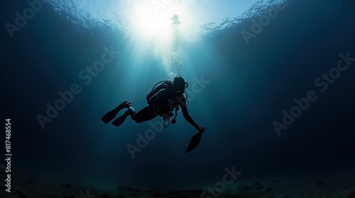 A scuba diver is checking a healthy coral reef in a tropical sea © Gipsy_studio