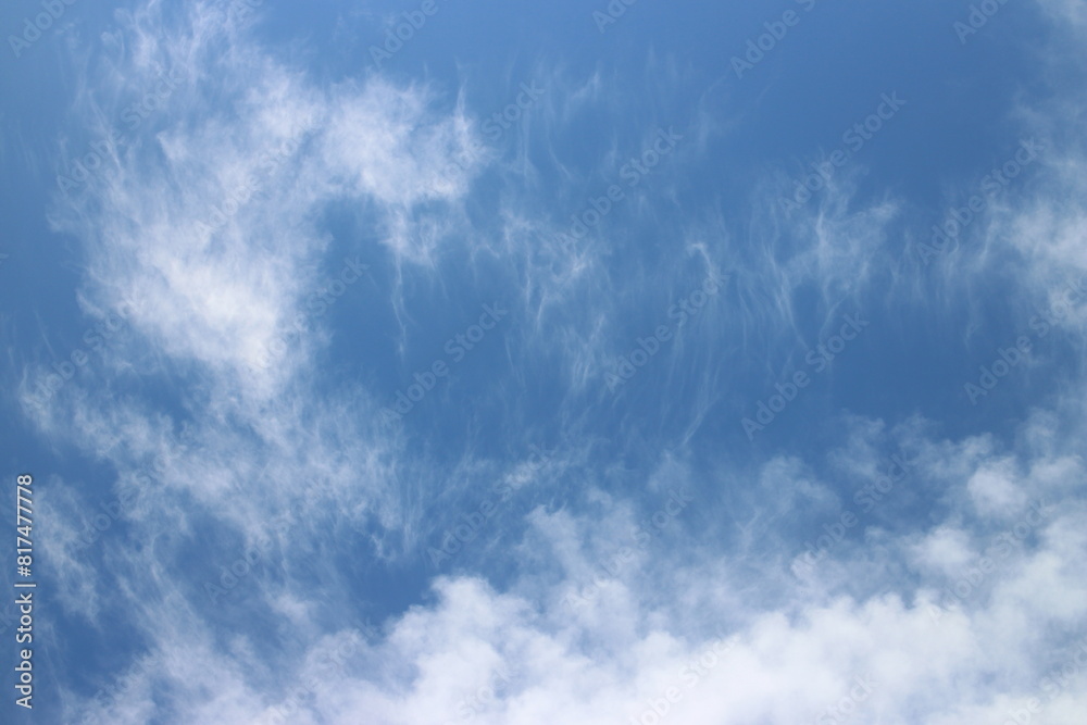 Obraz premium blue sky with white, soft clouds