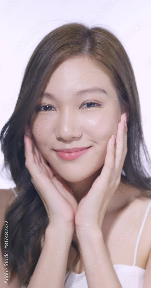 Vertical clip. A young woman is not worried about her face being exposed to bright sunlight during the day. Vertical clip. A young woman is not worried about her face being exposed to bright sunlight during the day.