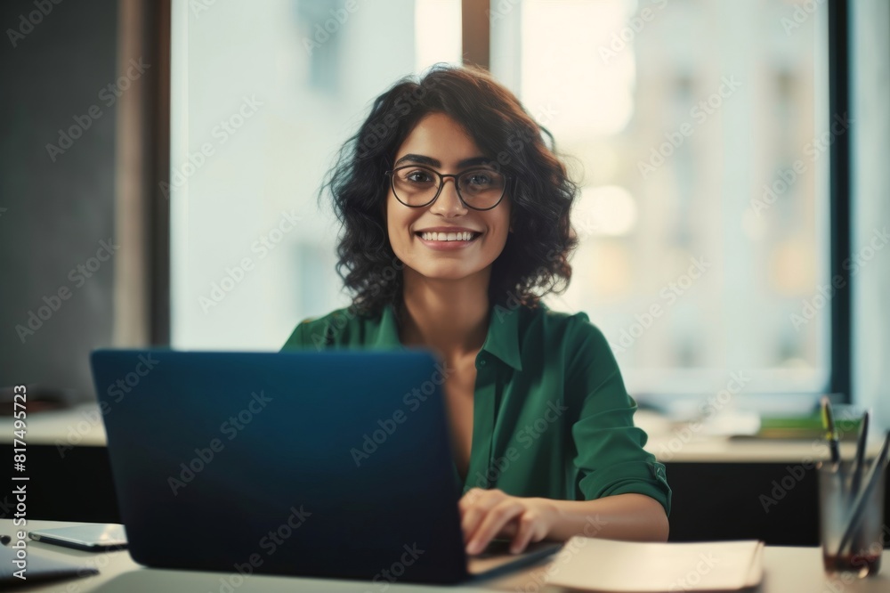 business woman, smile and working on laptop in office or company looking happy and satisfied. portrait of brazilian female worker or employee typing email on computer and planning strategy for vision business woman, smile and working on laptop in office or company looking happy and satisfied. portrait of brazilian female worker or employee typing email on computer and planning strategy for vision