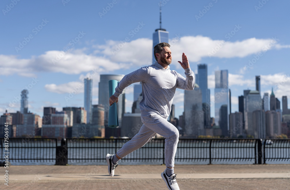 Running man in Manhattan. Runner at long sport run. The jogger run at sport training outdoor. Morning sport workout runner running in NY. Sportsman man running. Trail running Running man in Manhattan. Runner at long sport run. The jogger run at sport training outdoor. Morning sport workout runner running in NY. Sportsman man running. Trail running