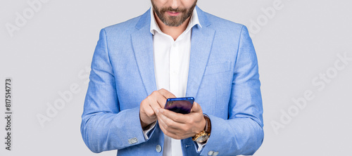 Man phone conversation in studio. Middle aged hispanic business man with phone. Business communication. Casual business man chatting on phone isolated on grey. Businessman using phone to reply