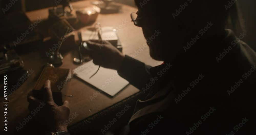 Man working at his desk at night. Man working at his desk at night.