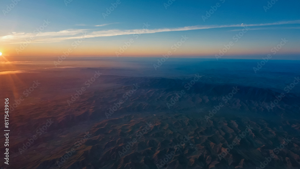 view of sky and clouds - The view of the sky and the pattern of clouds during the flight (Golden Time) from the airplane window view of sky and clouds - The view of the sky and the pattern of clouds during the flight (Golden Time) from the airplane window