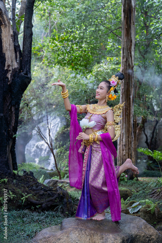 Lady in Thai literature. Beautiful girl in a Kinnari or Kinnaree dress in Himmapan forest , Kinnaree is an animal, The upper body is human and lower part is a bird with wings to fly.
