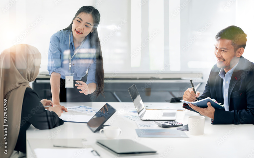 Young Office colleagues having casual discussion during meeting in conference room. Young Office colleagues having casual discussion during meeting in conference room.