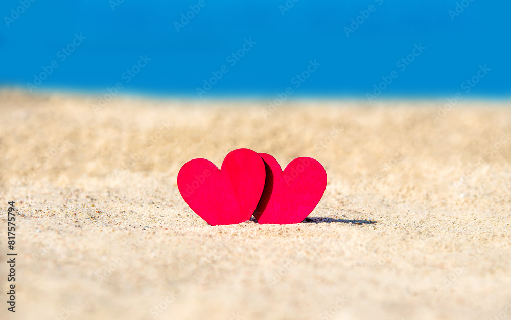 romantic symbol of two hearts on the beach
