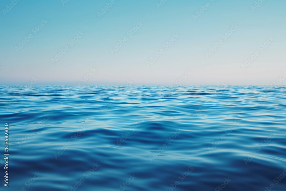 The ocean is calm and peaceful, with no visible waves or ripples The ocean is calm and peaceful, with no visible waves or ripples
