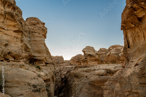 Wallpaper Mural View of the narrow Siq canyon pathway leading to Petra, Jordan, with towering sandstone cliffs. Torontodigital.ca
