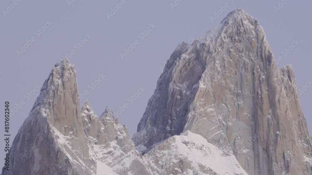 Close-up view of Mount Fitz Roy illuminated by the violet morning light in Patagonia, Argentina Close-up view of Mount Fitz Roy illuminated by the violet morning light in Patagonia, Argentina