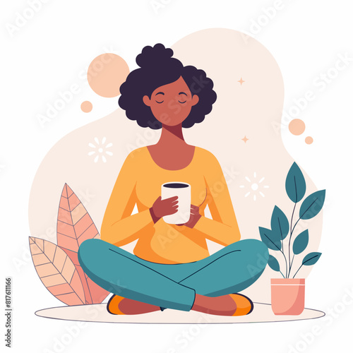 A woman is sitting cross legged with a cup in her hand. She is looking at the camera