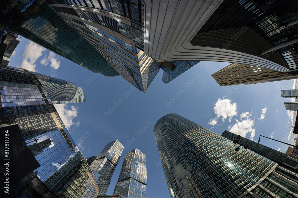 Ταπετσαρία View looking up at modern, glass skyscrapers with blue sky and clouds taken with a fisheye lens; tall office blocks in Moscow City financial centre or district with a fisheye lens