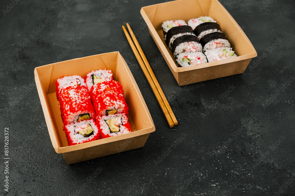 Sushi in Takeaway Boxes. Sushi Rolls in eco-friendly boxes. Sushi in Takeaway Boxes. Sushi Rolls in eco-friendly boxes.