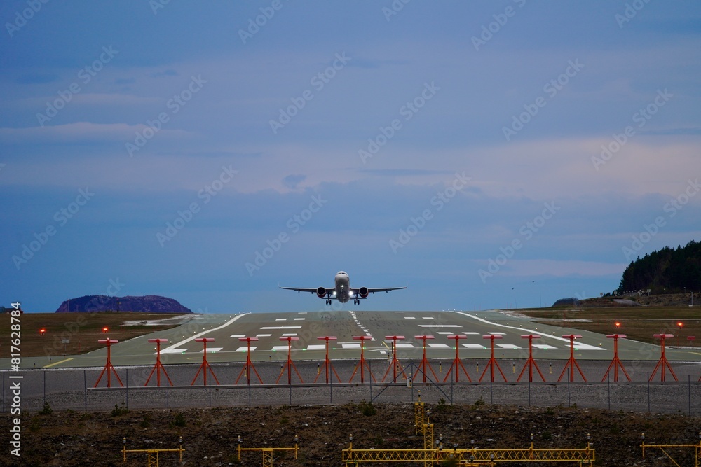 Passenger plane taking off from Kverngerget airport in Kristiansund, Norway Passenger plane taking off from Kverngerget airport in Kristiansund, Norway