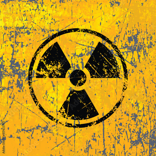 scratched distressed radiation symbol on dirty grungy yellow wall texture background vector illustration