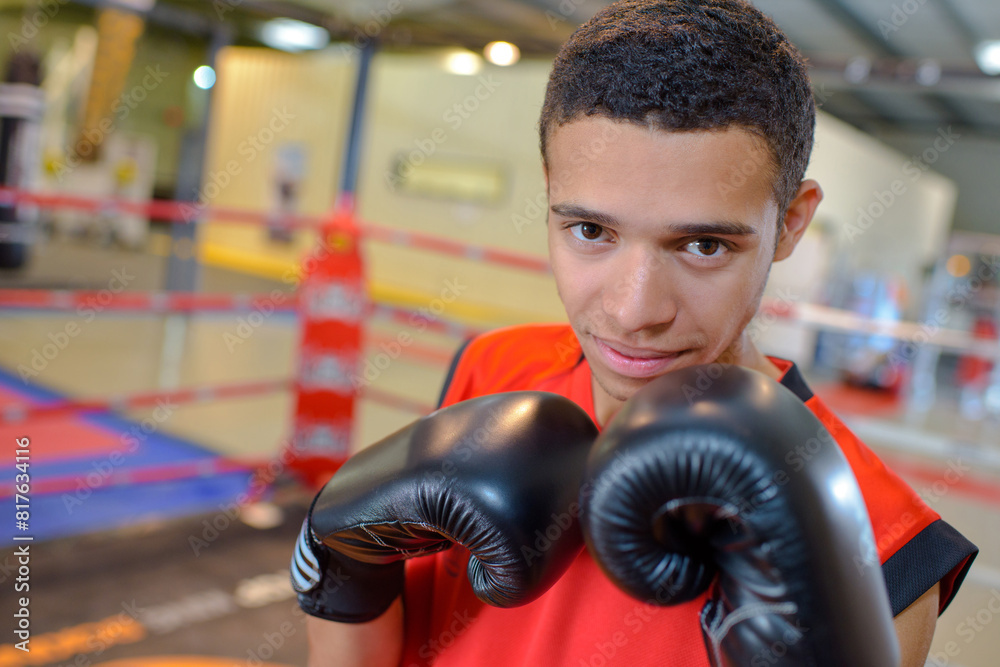 Portrait of young man in boxing gloves