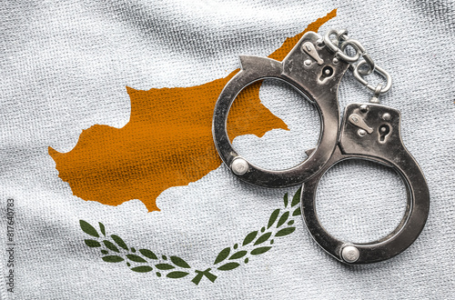 Flag of Cyprus and police handcuffs. Crime and offenses in country Concept	
