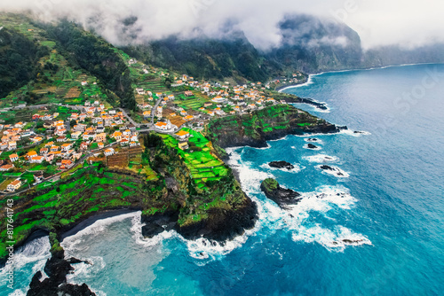 Aerial view of rough ocean with waves, volcanic beach and swiming pool in Seixal, Madeira, Portugal photo