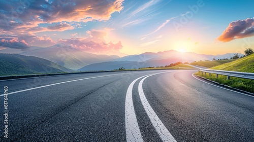 A sunrise vista of a paved road and scenic mountains. photo