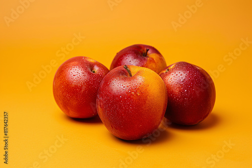 nectarin fruits on the yellow background photo