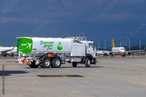 Sustainable Aviation Fuel (SAF) truck is waiting for aircraft refueling operation at the airport.