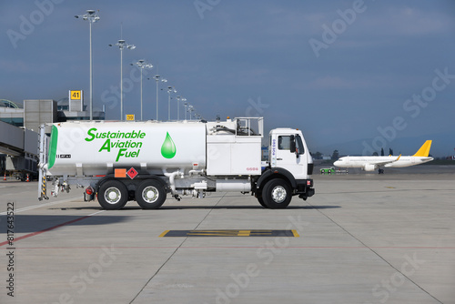Sustainable Aviation Fuel (SAF) truck is waiting for aircraft refueling operation at the airport.