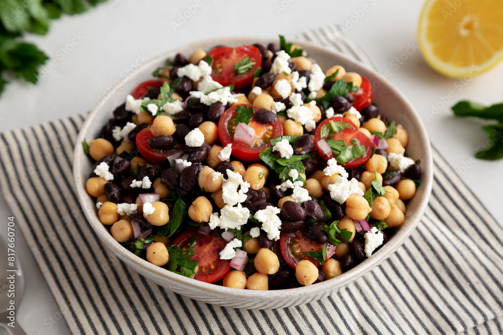 Homemade Chickpea And Black Bean Salad in a Bowl, side view. Homemade Chickpea And Black Bean Salad in a Bowl, side view.