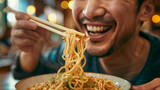 Joyful Man Eating Noodles with Chopsticks