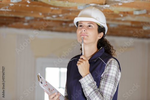 pensive builder woman looking away