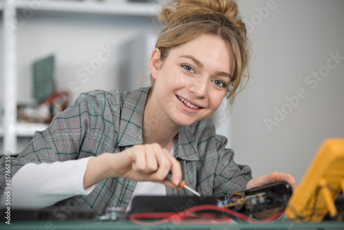 female electrician working with devices