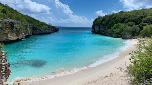 Tranquil and serene secluded beach cove paradise with turquoise water. Lush greenery. And pristine sandy beach