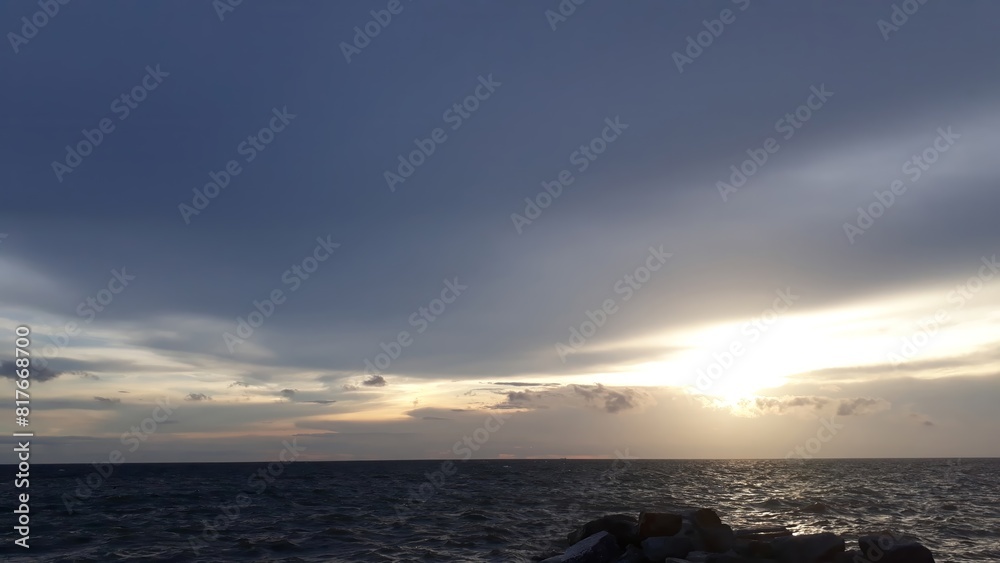 The Mesmerizing Golden Glow of the Setting Sun Gently Kissing the Endless Horizon, As the Tranquil Waves of the Ocean Embrace the Boundless Sky in an Eternal Dance of Nature’s Serene Beauty The Mesmerizing Golden Glow of the Setting Sun Gently Kissing the Endless Horizon, As the Tranquil Waves of the Ocean Embrace the Boundless Sky in an Eternal Dance of Nature’s Serene Beauty